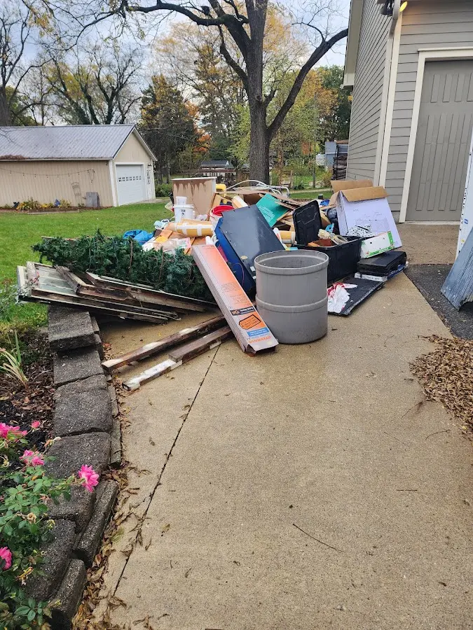 Dumpster being loaded with debris for Demolition Dumpster Rental in Chagrin Falls